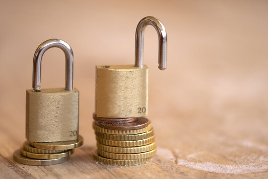 Brass Padlocks on Euro Coins Stack for Financial Security Concept