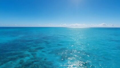 Obraz premium Serene turquoise ocean landscape under a clear blue sky