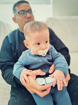 father and son playing video games