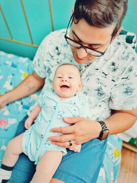 dad with happy baby