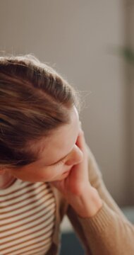 Woman, stress and headache with documents for debt, mortgage expenses or tax inflation in home. Frustrated, female person or migraine with concern, papers or invoices for financial crisis or bills