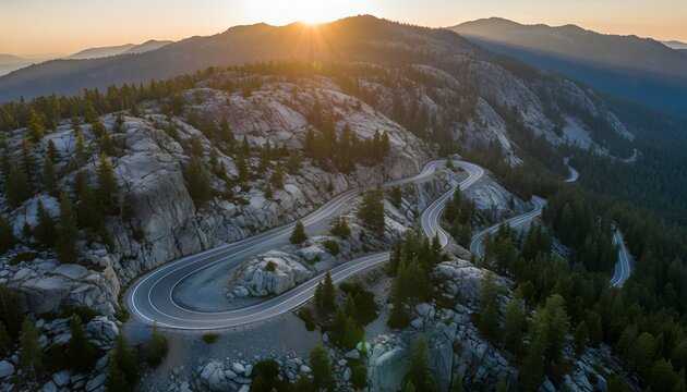 Aerial view of a mountain switchback curve road at sunset, representing the journey and progress concept for travel, adventure, and overcoming obstacles in nature