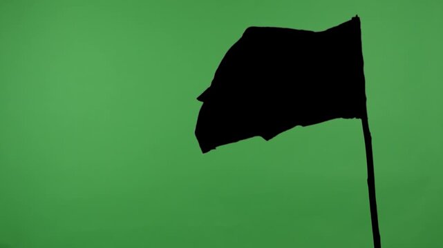 Black flag on a pole against a green background with alpha channel. Concept of symbol, protest, warning, anonymity, and chroma key element for video editing and design.