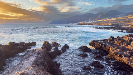 Dramatic volcanic coastline at sunset in Alcala Tenerife Canary Islands © Victoria Schaad