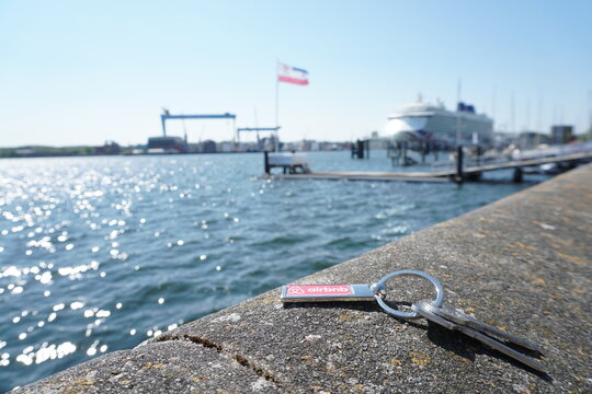 Airbnb Key at Kiel Harbor with Cruise Ship