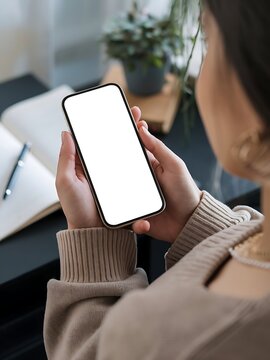 Mockup a phone with a white screen in female hands