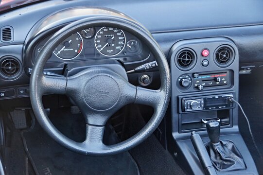 Mazda Miata NA interior showing dashboard and steering wheel