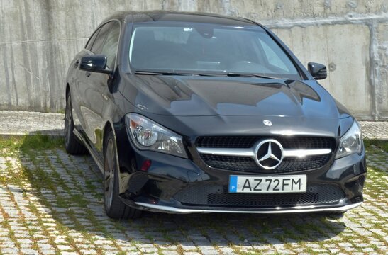 Mercedes-Benz CLA parked on a cobblestone lot