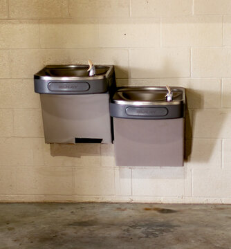 Water drinking fountains mounted on a wall