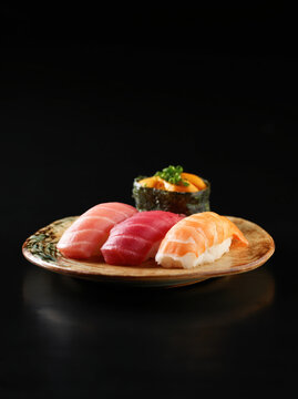 Assorted Sushi Platter with Salmon Nigiri and Rolls. AI generative.