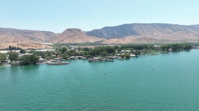 Aerial Panorama of the Sea of Galilee (Kinneret) Shoreline Featuring Resorts, Green Water, and Arid Mountains