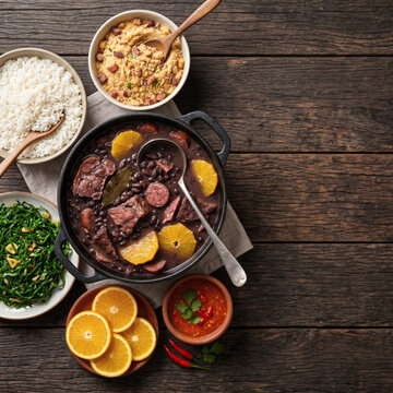 Feijoada Completa - Top View Flat Lay on Aged Wood Table