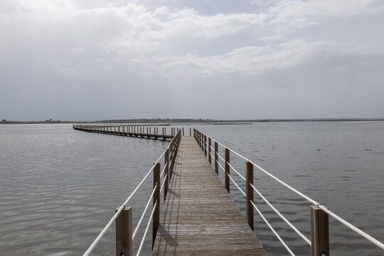 Boardwalk extending across alqueva lake in aldeia da luz