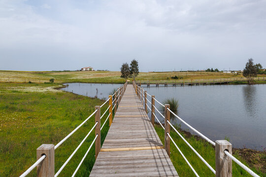 Boardwalk crossing a lake in aldeia da luz alentejo portugal