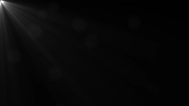 Soft white light rays emanating from the upper left corner with subtle bokeh circles scattered across a dark black background creating a gentle atmospheric effect