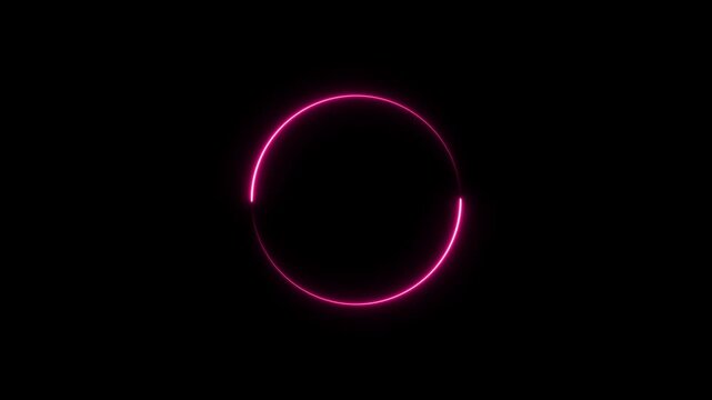 A vibrant pink neon circle with a broken segment glows against a stark black background creating a futuristic and abstract visual