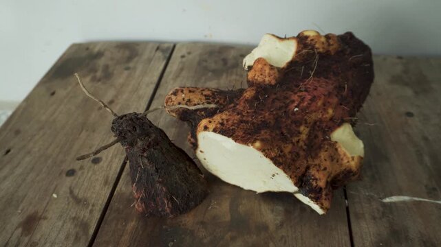 Fresh Root Vegetables with Soil on Rustic Wooden Table