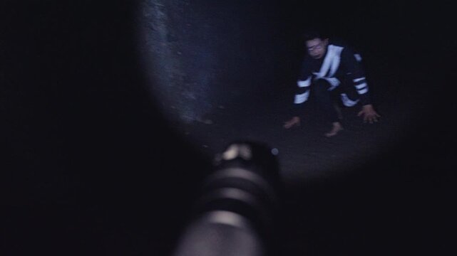 A terrifying first-person POV shot where a flashlight beam finds a costumed dancer who performs a frantic, aggressive dance in the dark. A perfect "jump scare" moment for horror or thriller films.