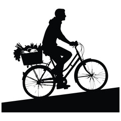 Fototapeta premium Person silhouette riding a bicycle with a basket of fresh vegetables