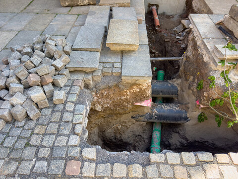 Renovation of gas pipeline in the city with cobblestone path