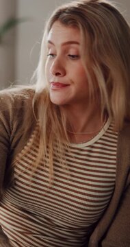 Woman, phone and bored with remote work from home, computer or project with distraction on web. Person, virtual assistant or annoyed on mobile app, notification or fake news on social media in house