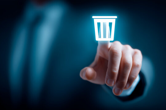 Data deletion and privacy management depicted by a finger pressing a virtual trash icon, conveying removal, cleanup and regulatory compliance