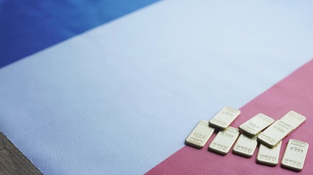 Gold Bullion Bars on French National Flag Close-up