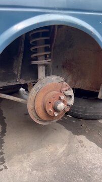 Rusty Car Brake Disc and Suspension Lack of Maintenance Concept