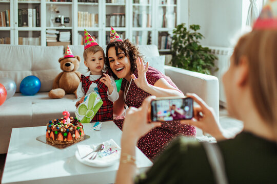 Mother and child celebrate birthday at home