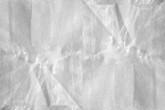 Destroyed Grey Nonwoven Spunbond Fabric with Peeling Distressed Grunge Texture Overlay - The Rugged Texture Offers a Strong Visual Aesthetic, Suitable for Fashion Design and Creative Projects.