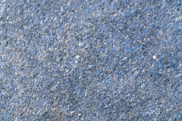Naklejka premium an uneven, gritty surface with tiny sparkling particles. Rough concrete texture