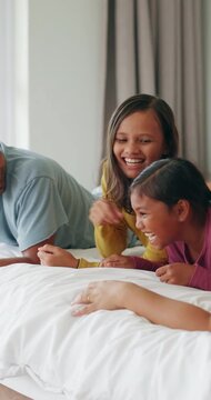 Jump, parent or girls on bed with bonding together, childcare or happiness in healthy relationship. Laugh, family or children in house with connection, sibling play or fun time at start of day.