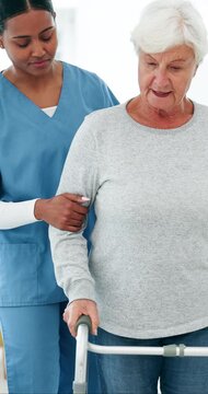 Old woman, walker and help for physiotherapy with support for recovery, talk and balance in retirement. Senior person with disability, rehabilitation or mobility with walking frame at wellness clinic