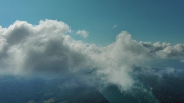 Aerial high view of clouds and blue sky, flying in clouds, 4k