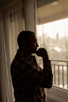 Man with headache, depression, sadness and loneliness at home