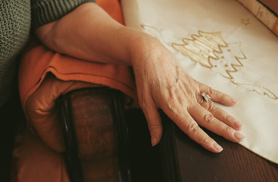 Elderly woman hands. Senior old lady experiencing severe arthritis rheumatics pains, massaging, wrinkles, veins, warming up arm. Close-up.