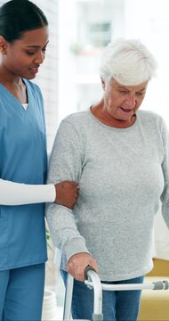 Old woman, walker and physiotherapy with support, balance and talk with recovery in retirement. Senior person with disability, rehabilitation or guide for mobility, walking frame or help at clinic