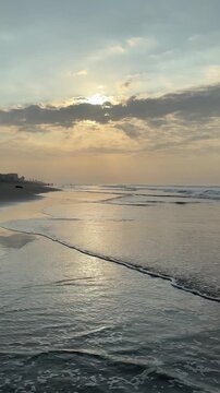El Pared&oacute;n, Guatemala, is a serene black sand beach with crashing Pacific waves, palm trees, surfers, and breathtaking golden sunsets.