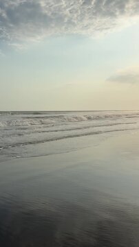 El Pared&oacute;n, Guatemala, is a serene black sand beach with crashing Pacific waves, palm trees, surfers, and breathtaking golden sunsets.