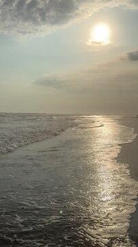 El Pared&oacute;n, Guatemala, is a serene black sand beach with crashing Pacific waves, palm trees, surfers, and breathtaking golden sunsets.