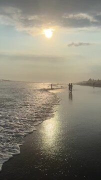 El Pared&oacute;n, Guatemala, is a serene black sand beach with crashing Pacific waves, palm trees, surfers, and breathtaking golden sunsets.