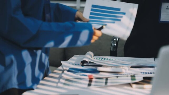 Auditor and accountant team working in office, analyze financial data and accounting record with calculator. Accounting company provide finance and taxation planning for profitable cash flow. Insight