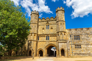 Obraz premium Medieval Gatehouse of Battle Abbey in Battle, East Sussex, England, UK under Blue Sky