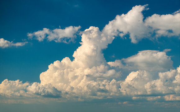 Blue sky with white clouds. Bright summer skyscape