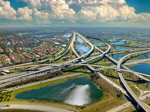 USA car urban transportation infrastructure. American highway junction with fast driving vehicles in Miami, Florida