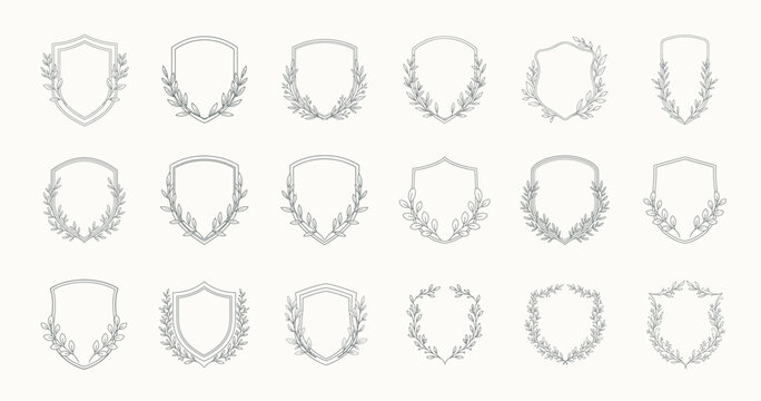 Set of minimalist coats of arms with botanical branches on the sides in a thin outline style, clean