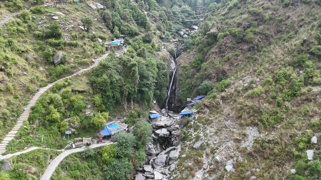Bhagsu Nag Waterfall Flowing Through Mountain Canyon Aerial View