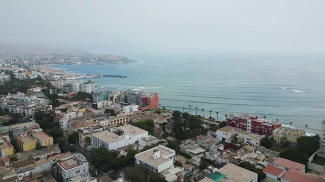 Beautiful drone video of Barranco, Lima, Peru, with ocean views on a cloudy autumn day.