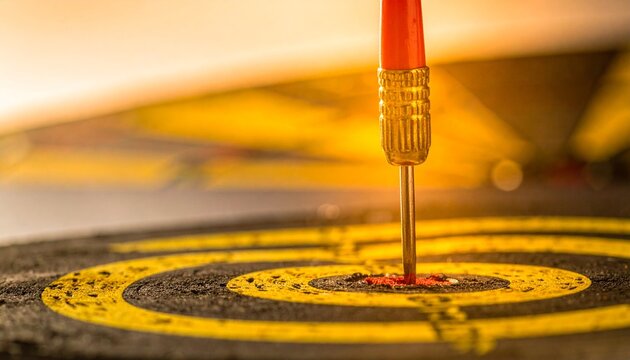 Red Dart Hitting Bullseye on Dartboard
