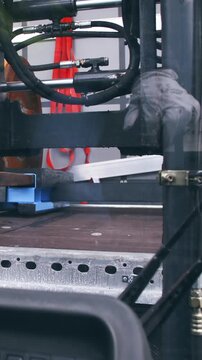 Lifting the cargo from trailer with forklift POV